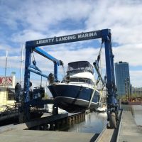 A boat being lifted at Liberty Landing Marina.